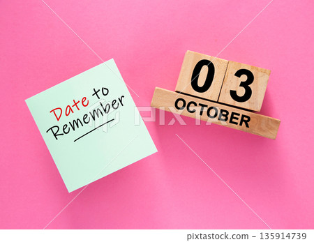 Date October 03 to remember concept with sticky note and wooden calendar 135914739