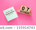Date October 07 to remember concept with sticky note and wooden calendar 135914743