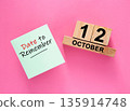 Date October 12 to remember concept with sticky note and wooden calendar 135914748