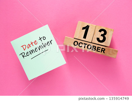 Date October 13 to remember concept with sticky note and wooden calendar Date October 13 to remember concept with sticky note and wooden calendar 135914749