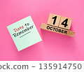 Date October 141 to remember concept with sticky note and wooden calendar 135914750