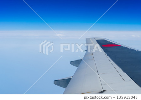 A blue sky seen from an airplane 135915043