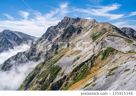 View of Mt. Hakuba in the Ushiro-Tateyama mountain range from Mt. Korenge. Traverse from Hakuba-Oike to Mt. Hakuba in the Northern Alps. View of Mt. Hakuba in the Ushiro-Tateyama mountain range from Mt. Korenge. Traverse from Hakuba-Oike to Mt. Hakuba in the Northern Alps. 135915148