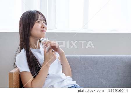 A young woman with a smartphone A young woman with a smartphone 135916044