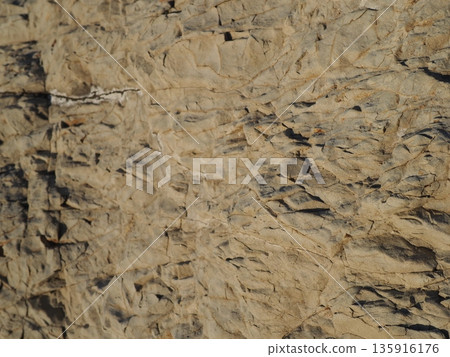 Rock and sand art. Enjoy the seascape. Copy space. An artistic background woven by nature. Rock and sand art. Enjoy the seascape. Copy space. An artistic background woven by nature. 135916176