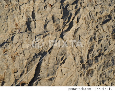 Rock and sand art. Enjoy the seascape. Copy space. An artistic background woven by nature. Rock and sand art. Enjoy the seascape. Copy space. An artistic background woven by nature. 135916219