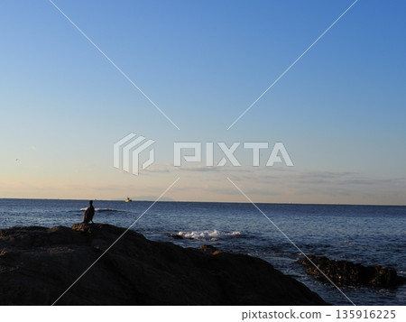 Rock and sand art. Enjoy the seascape. Copy space. An artistic background woven by nature. Rock and sand art. Enjoy the seascape. Copy space. An artistic background woven by nature. 135916225