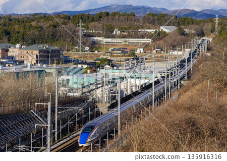 Running Hokuriku Shinkansen Running Hokuriku Shinkansen 135916316