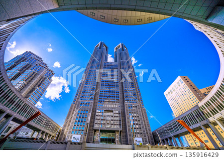 Tokyo cityscape in Japan: View of Tokyo Metropolitan Government Building and office buildings in Shinjuku. Blue skies spread out. (January 25, 2026) Tokyo cityscape in Japan: View of Tokyo Metropolitan Government Building and office buildings in Shinjuku. Blue skies spread out. (January 25, 2026) 135916429