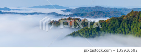 Bitchu Matsuyama Castle floating in a sea of clouds in the early morning as seen from the Unkai Observatory in Takahashi City, Okayama Prefecture, Japan 135916592