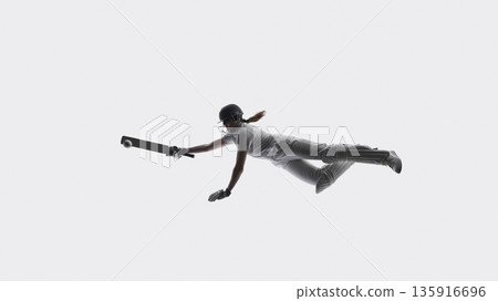 Female cricket player diving forward with bat in full protective gear on white background. 135916696
