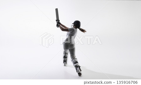 Female cricket player follow through swing isolated on white background. Female cricket player follow through swing isolated on white background. 135916706