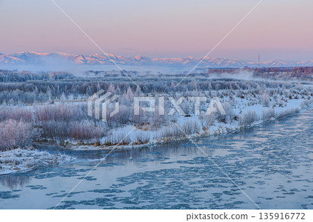 A quiet dawn over the Tokachi River and the Hidaka Mountains in the dead of winter A quiet dawn over the Tokachi River and the Hidaka Mountains in the dead of winter 135916772
