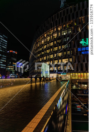 Flowing lights illuminating the night streets of Umeda, Osaka 135916774