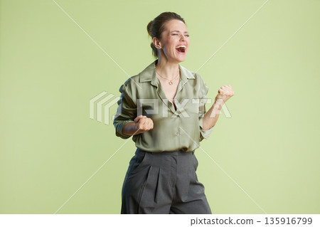 Celebrating success: Woman's joyful victory Celebrating success: Woman's joyful victory 135916799