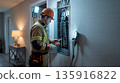 Electrician tests residential breaker panel safely. Skilled electrician uses multimeter on wiring, electrician service for home inspection, spring cleaning, emergency repair, safety compliance concept 135916822