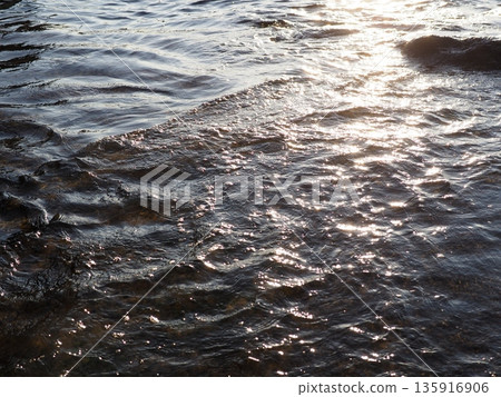 Art of light reflected on the water surface. Copy space. Water art background. Art of a moment. Cherish that moment. Art of light reflected on the water surface. Copy space. Water art background. Art of a moment. Cherish that moment. 135916906
