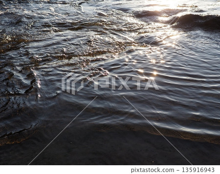 Art of light reflected on the water surface. Copy space. Water art background. Art of a moment. Cherish that moment. Art of light reflected on the water surface. Copy space. Water art background. Art of a moment. Cherish that moment. 135916943