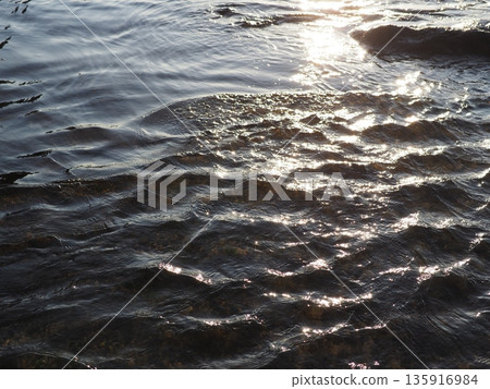 Art of light reflected on the water surface. Copy space. Water art background. Art of a moment. Cherish that moment. Art of light reflected on the water surface. Copy space. Water art background. Art of a moment. Cherish that moment. 135916984