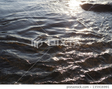 Art of light reflected on the water surface. Copy space. Water art background. Art of a moment. Cherish that moment. Art of light reflected on the water surface. Copy space. Water art background. Art of a moment. Cherish that moment. 135916991