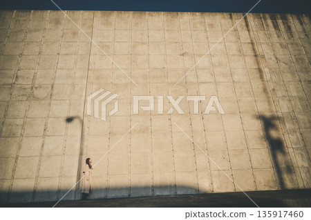 Wall, woman and shadow 135917460