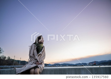 Evening sea and sky and young woman 135917560