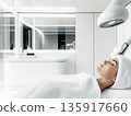 A woman lies relaxed in a 135917660