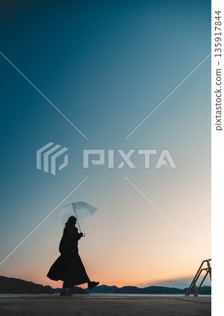 Fantastic evening sky and woman 135917844