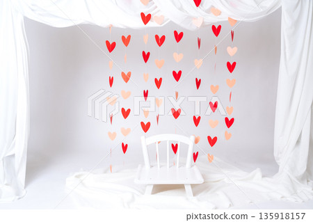 Minimal Valentines Day photo backdrop with heart decorations and white drapery. Romantic background for photoshoots, events and creative projects Minimal Valentines Day photo backdrop with heart decorations and white drapery. Romantic background for photoshoots, events and creative projects 135918157