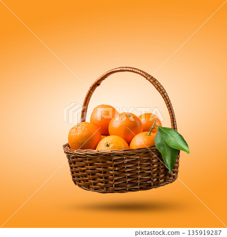 Orange fruits in a wicker basket 135919287
