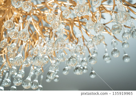 Elegant crystal chandelier details with soft focus. Luxury interior decor, refined lighting and sophisticated design background 135919965
