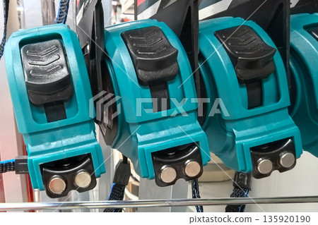 Tools lined up in vibrant colors ready for work in a hardware store Tools lined up in vibrant colors ready for work in a hardware store 135920190
