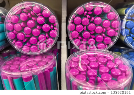 Colorful caps in vibrant jars showcasing creativity and organization Colorful caps in vibrant jars showcasing creativity and organization 135920191