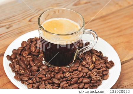 coffee in a glass mug and beans coffee in a glass mug and beans 135920953