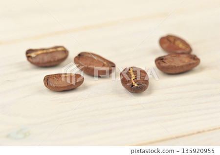 coffee beans on wooden background coffee beans on wooden background 135920955