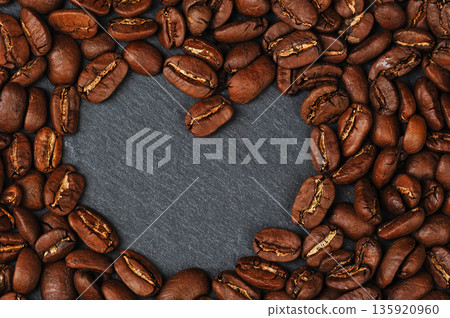whole coffee beans close-up. heart of coffee beans whole coffee beans close-up. heart of coffee beans 135920960