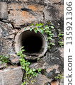 Large Drainage Pipe in a cement wall  135921306