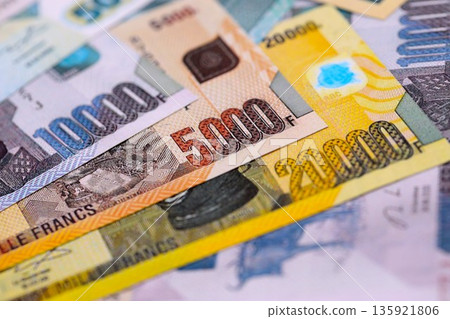 Congolese franc money bills in big amount on table close up. Rich life concept in Democratic Republic of Congo. Business and economy 135921806