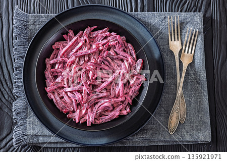 Beet salad with mayo and garlic in bowl 135921971