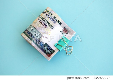 Egyptian pound money bills in big amount on blue close up. Finance and banking concept 135922272