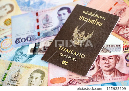 Thai baht currency money bills and passport close up. The concept of travel and vacation 135922309
