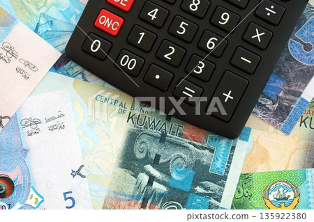 Kuwaiti dinar currency money bills and calculator close up. The concept of taxation and money count 135922380
