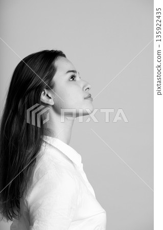 Woman looking up contemplating hope in black and white 135922435
