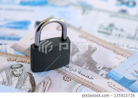United Arab Emirates dirham currency money bills and padlock close up. The concept of sanctions and financial safety United Arab Emirates dirham currency money bills and padlock close up. The concept of sanctions and financial safety 135922716