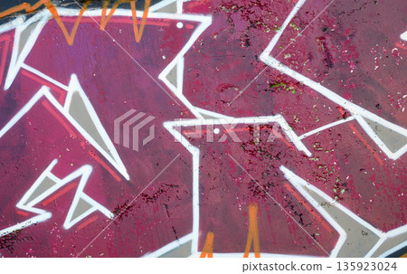 Colorful background of graffiti painting artwork with bright aerosol outlines on wall. Old school street art piece made with aerosol spray paint cans. Contemporary youth culture backdrop Colorful background of graffiti painting artwork with bright aerosol outlines on wall. Old school street art piece made with aerosol spray paint cans. Contemporary youth culture backdrop 135923024