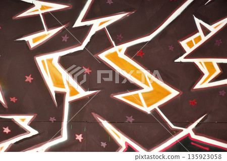 Colorful background of graffiti painting artwork with bright aerosol outlines on wall. Old school street art piece made with aerosol spray paint cans. Contemporary youth culture backdrop Colorful background of graffiti painting artwork with bright aerosol outlines on wall. Old school street art piece made with aerosol spray paint cans. Contemporary youth culture backdrop 135923058