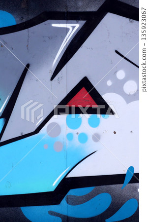 Colorful background of graffiti painting artwork with bright aerosol outlines on wall. Old school street art piece made with aerosol spray paint cans. Contemporary youth culture backdrop Colorful background of graffiti painting artwork with bright aerosol outlines on wall. Old school street art piece made with aerosol spray paint cans. Contemporary youth culture backdrop 135923067