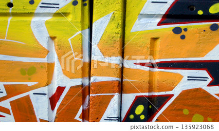 Colorful background of graffiti painting artwork with bright aerosol outlines on wall. Old school street art piece made with aerosol spray paint cans. Contemporary youth culture backdrop 135923068