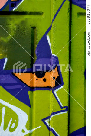 Colorful background of graffiti painting artwork with bright aerosol outlines on wall. Old school street art piece made with aerosol spray paint cans. Contemporary youth culture backdrop Colorful background of graffiti painting artwork with bright aerosol outlines on wall. Old school street art piece made with aerosol spray paint cans. Contemporary youth culture backdrop 135923077