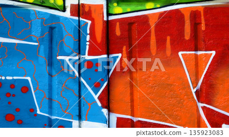 Colorful background of graffiti painting artwork with bright aerosol outlines on wall. Old school street art piece made with aerosol spray paint cans. Contemporary youth culture backdrop 135923083